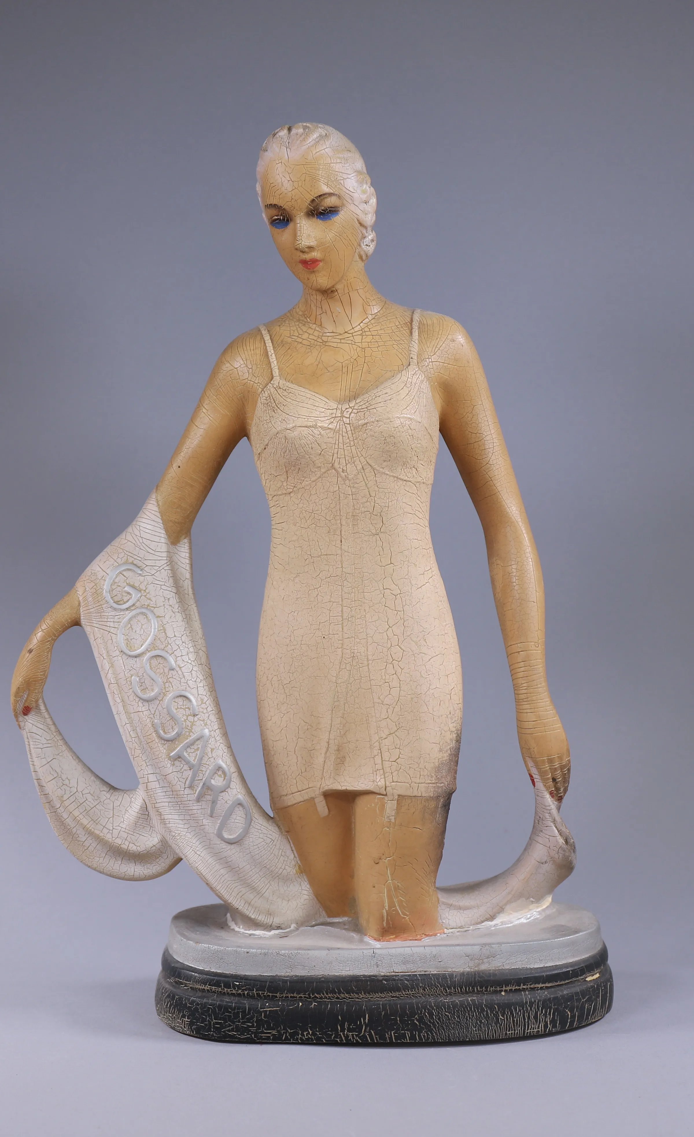 Art Deco-style figurine photographed as a distinctive estate sale collectible.