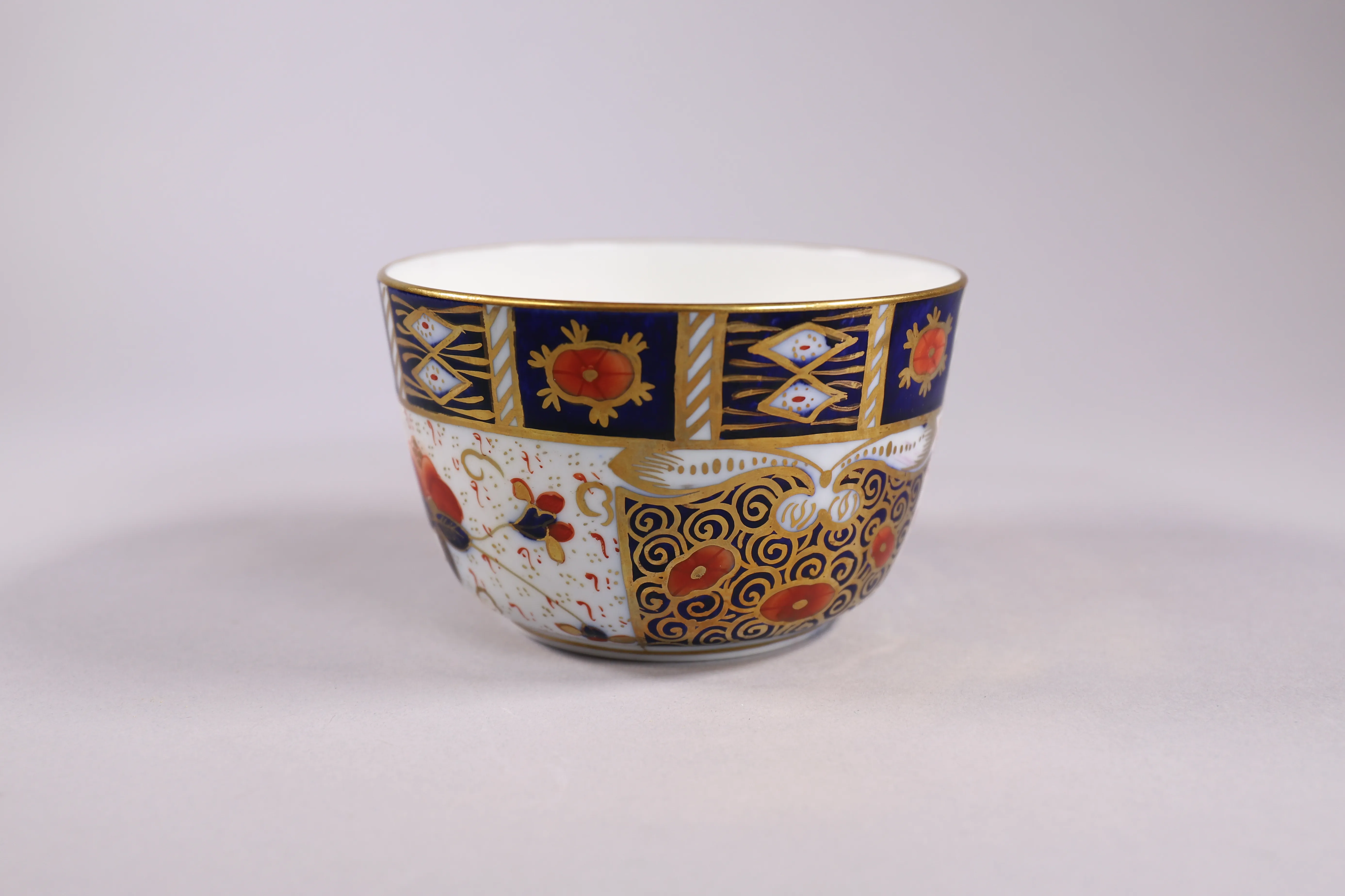 Patterned china bowl photographed as an estate sale object.